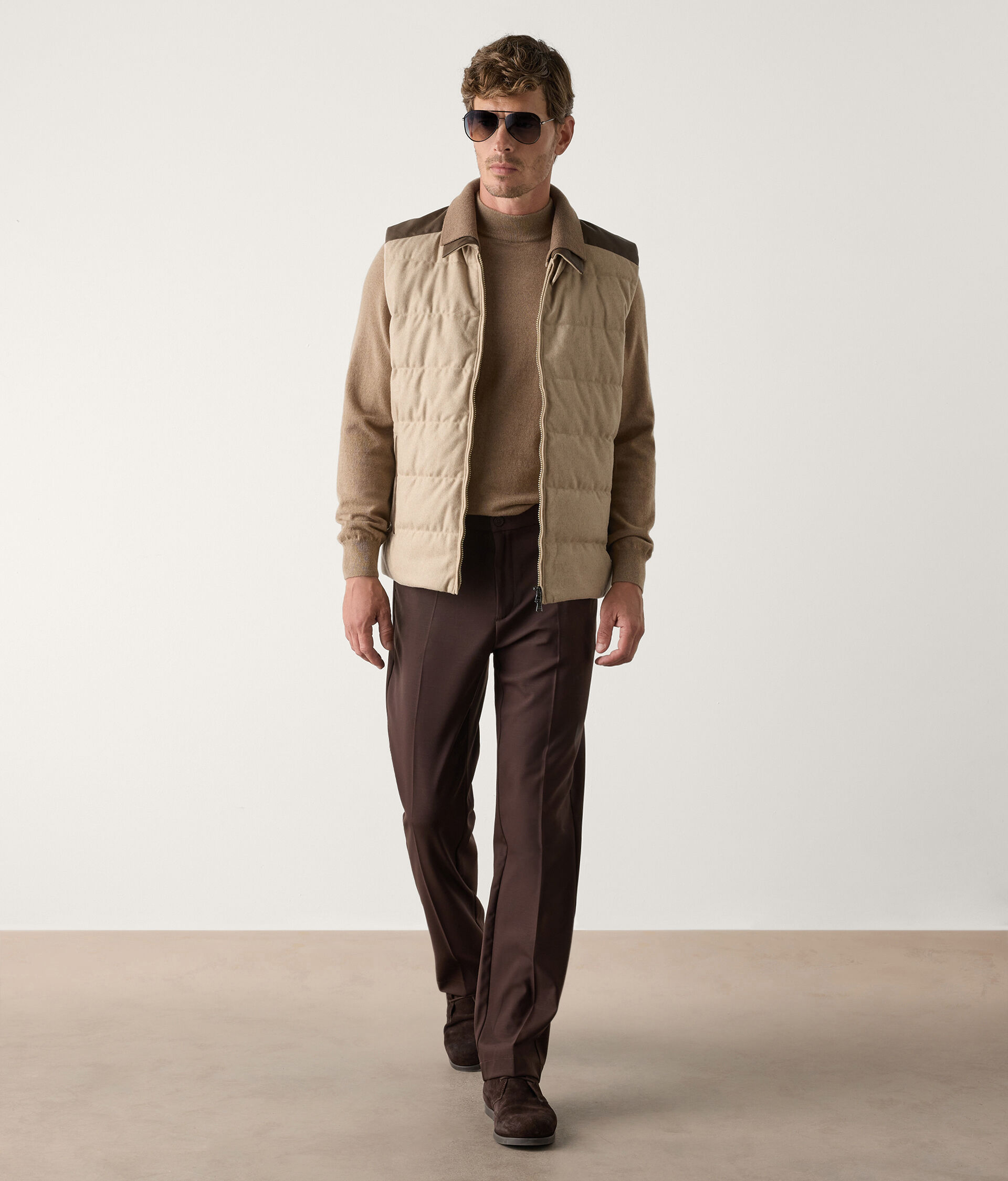 Sleeveless down jacket with leather details